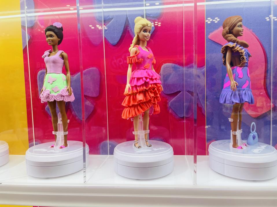 Barbie dolls wearing clothes made out of Play-Doh on display at the New York Toy Fair in 2025.