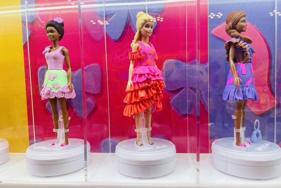 Barbie dolls wearing clothes made out of Play-Doh on display at the New York Toy Fair in 2025.