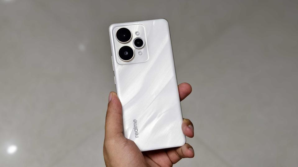 Prakhar Khanna holding the Realme 15 Pro.
