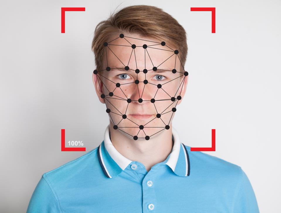 Facial Recognition Technology and Privacy concept. Young man and security technology