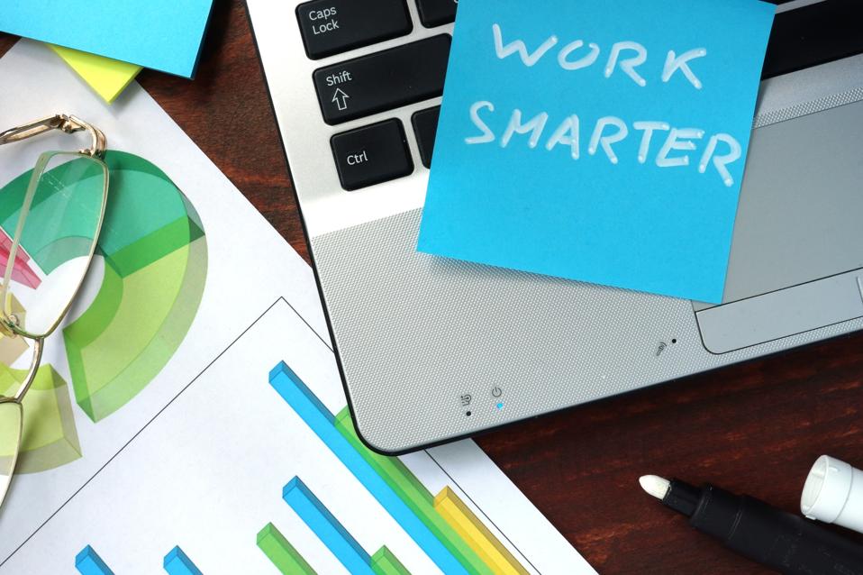 Work smarter sticky note on laptop representing ChatGPT agent prompts that save time.