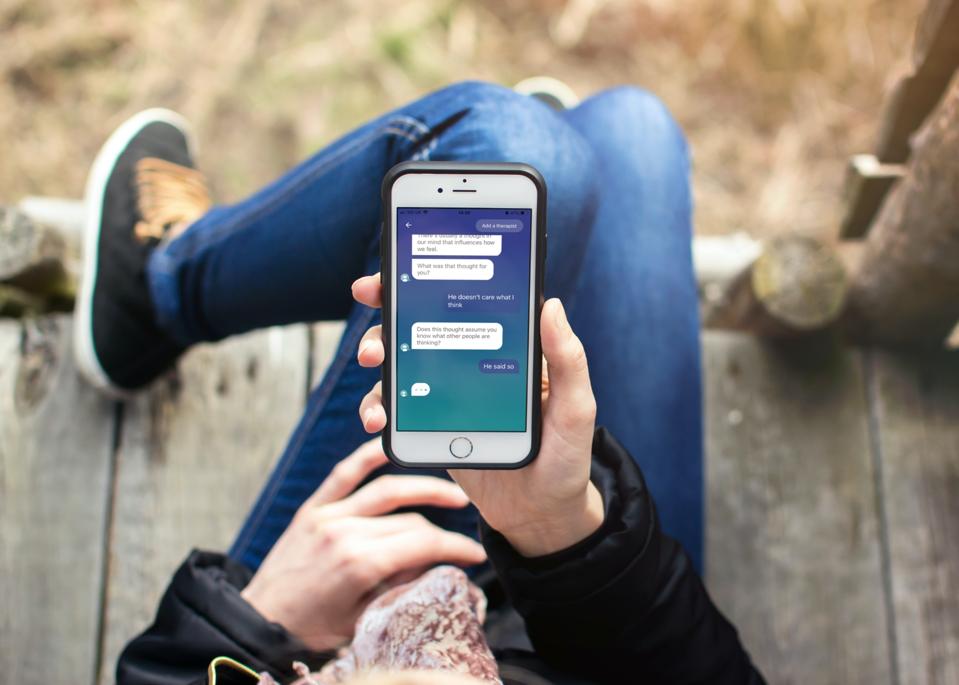 Photo of user in conversation with Wysa