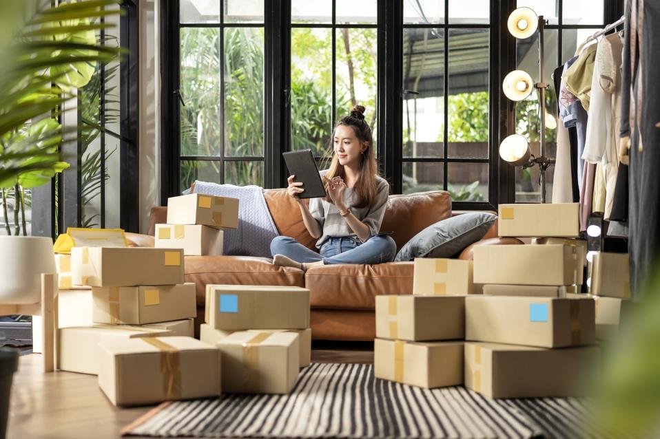 asian female talking smartphone with client order keying with laptop small business E-Commerce and Online Shopping, Small & New Business Entrepreneurship Online Retail Business, Online influencer on Social Media Concepts