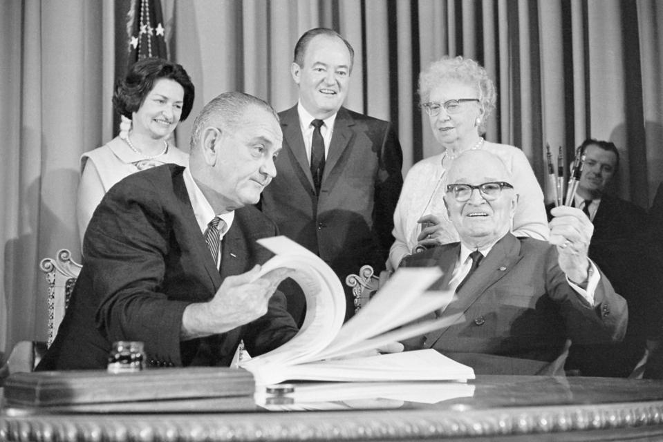Lyndon Johnson Looking Over Medicare Bill