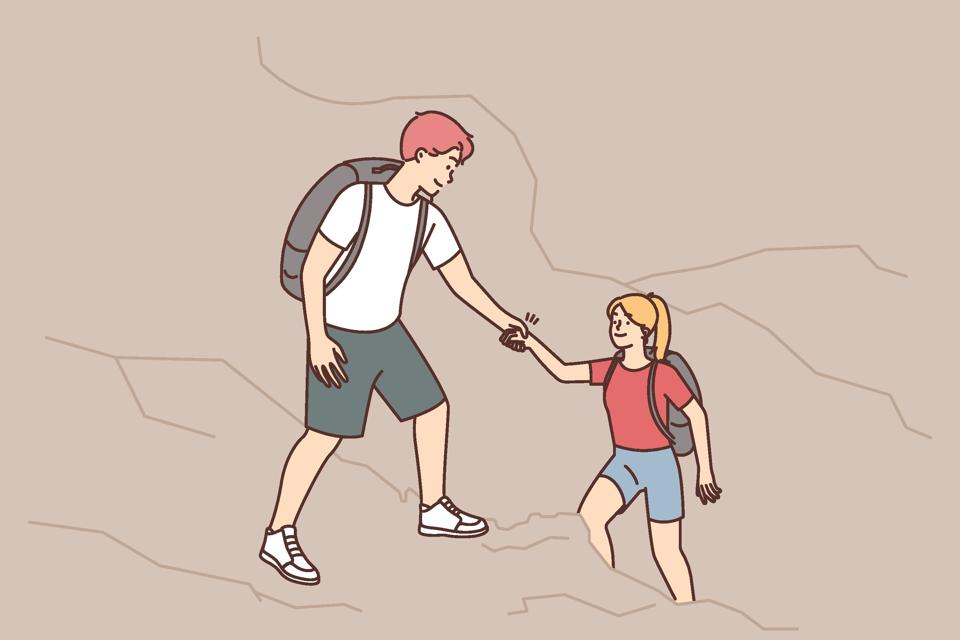 Caring man help woman with climbing