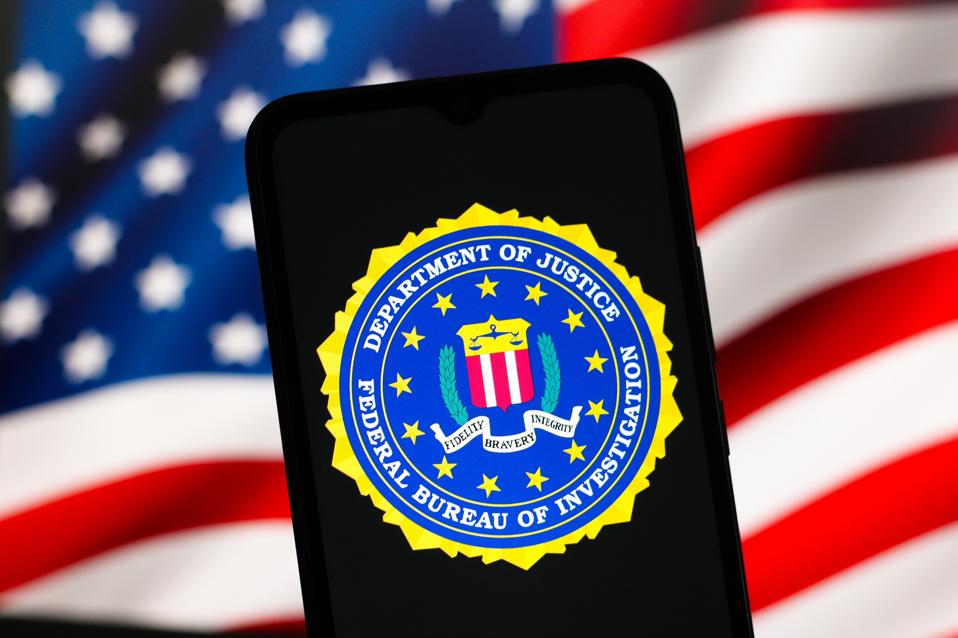 Federal Bureau of Investigation (FBI) logo is seen displayed on a smartphone screen. 
