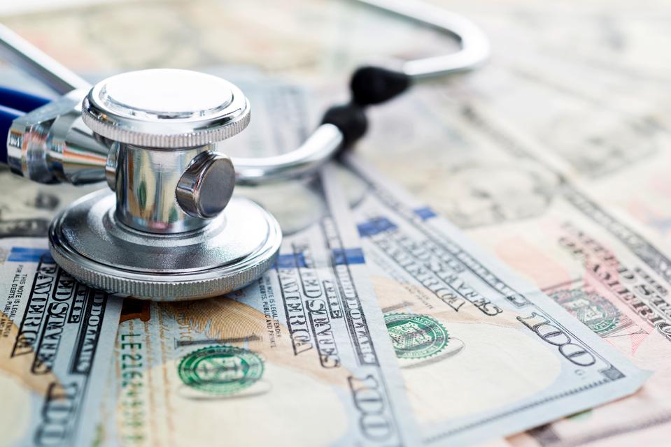 Stethoscope on us paper currency