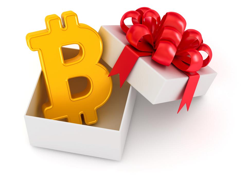 Bitcoin. Golden digital cryptocurrency sign in the white gift box with red tied bow. The best gift ever. 3d illustration isolated on the white background.