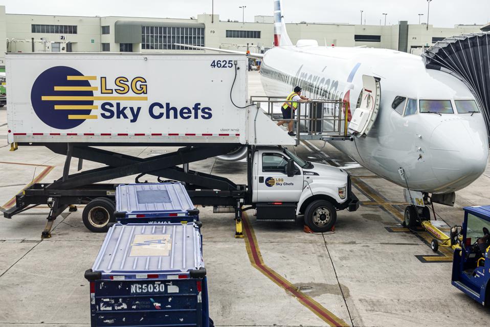 Miami, Florida, Miami International Airport, American Airlines jet on tarmac with LSG Sky Chefs catering service food being loaded