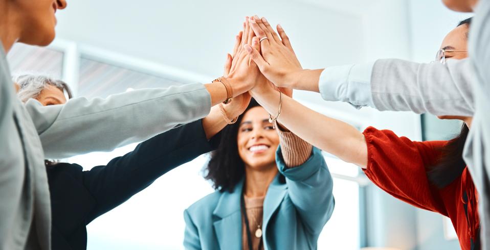 Hands, high five and team building in office with workers connecting in support of success and fun. Teamwork, collaboration and hand in solidarity of community goal, vision and mission for success