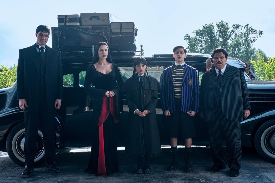 Joonas Suotamo, Catherine Zeta-Jones, Jenna Ortega, Isaac Ordonez, Thing, Luis Guzmán in "Wednesday Season 2, Part 1."