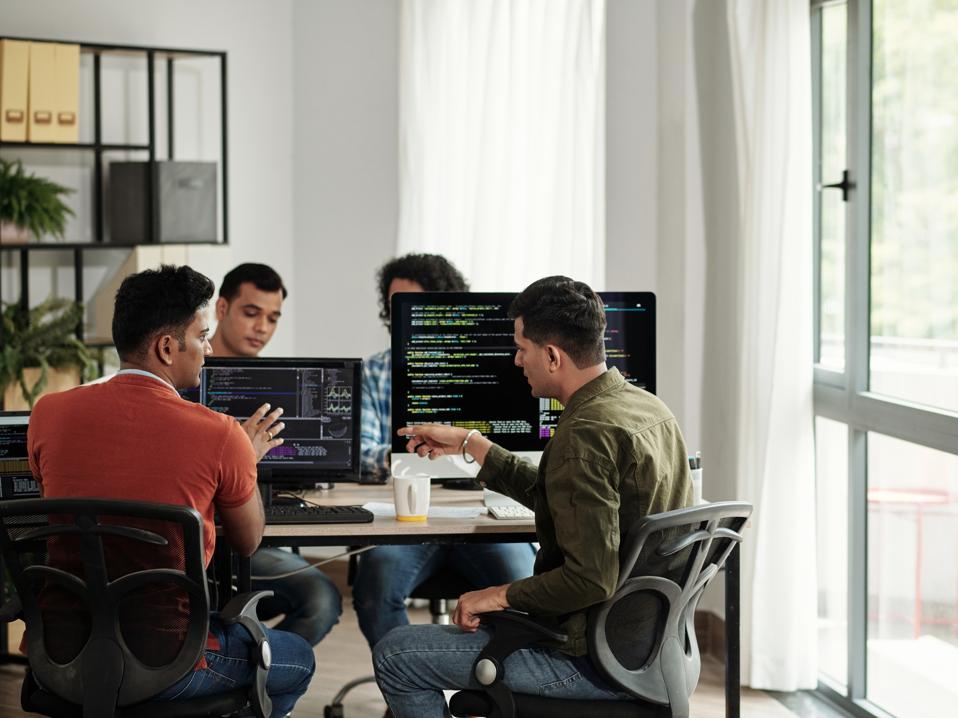 Developers Discussing Programming Code