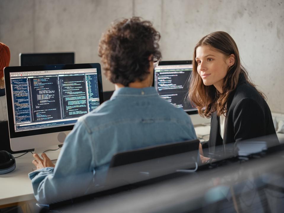 Smart Young Students Studying in University with Diverse Multiethnic Classmates. Scholars Collaborate in College Room on Computer Science Project, Writing Software Code in Successful Teamwork.