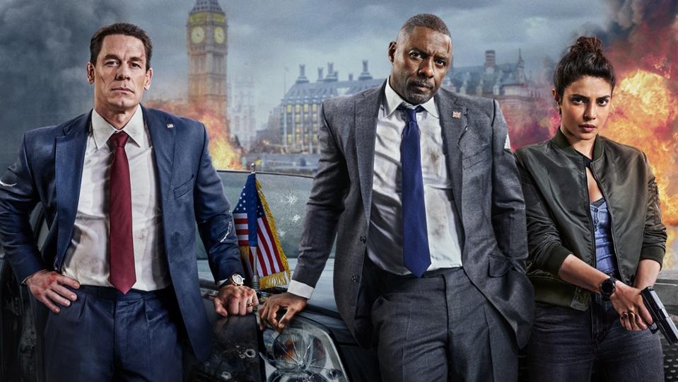 Indian star Priyanka Chopra Jonas with Idris Elba and John Cena on a poster of the Prime Video original 'Heads of State'.