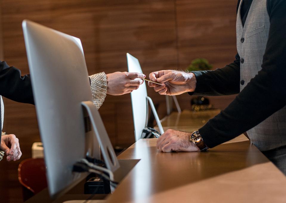 Businessman checking out at reception