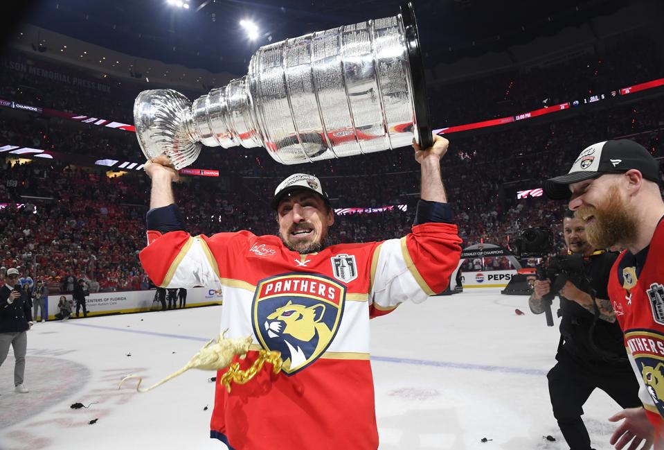 Brad Marchand hoisting the Stanley Cup after Game 6