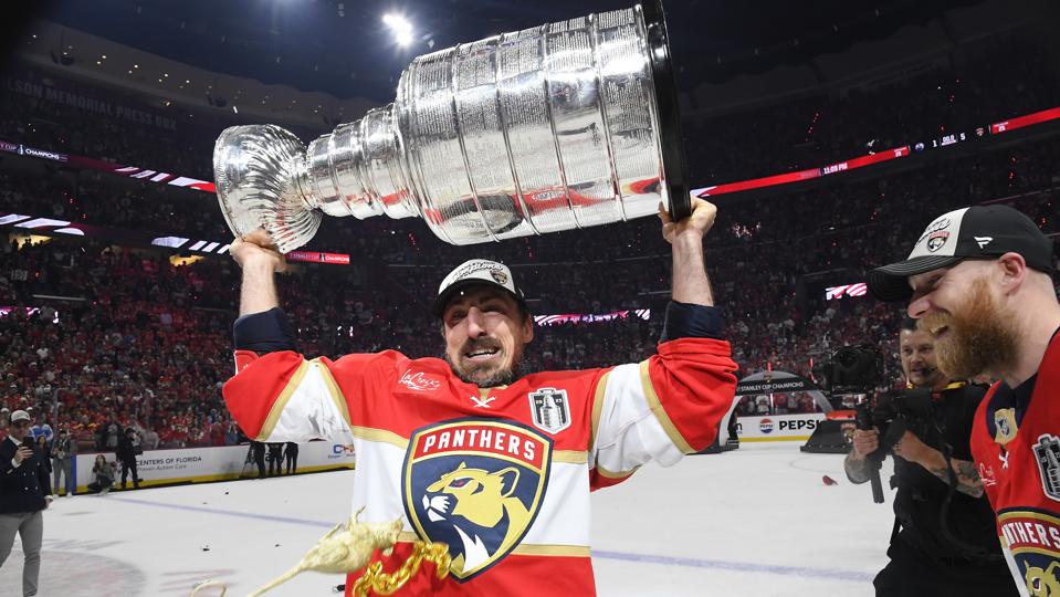 Brad Marchand hoisting the Stanley Cup after Game 6