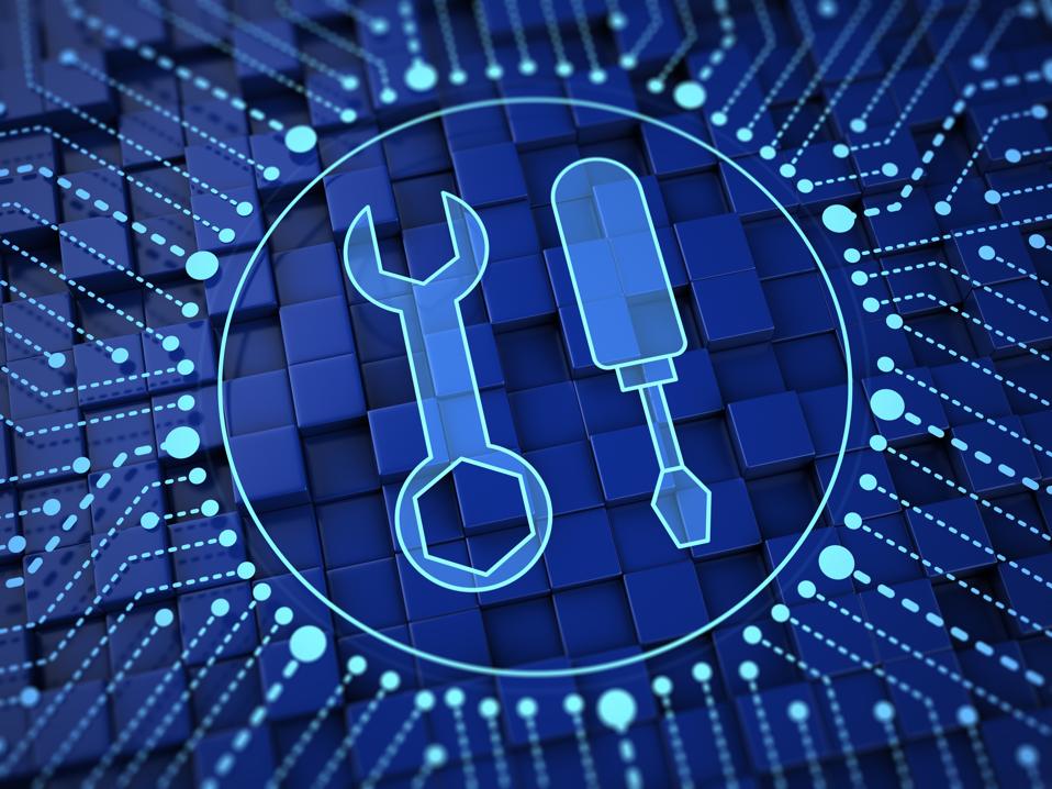 Digital illustration of blue background with dots forming circle. In the center are the outlines of a wrench and screwdriver. Tech hardware concept.