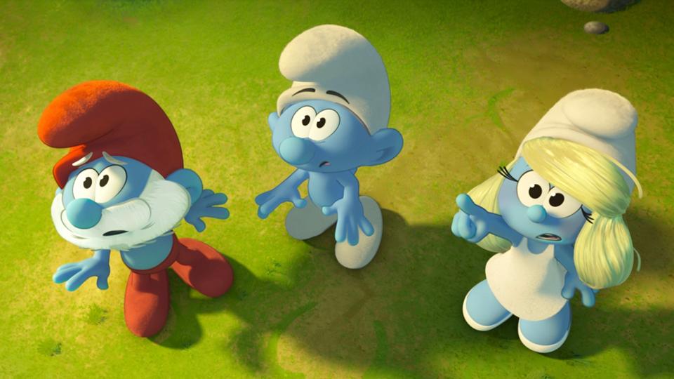 Papa Smurf (voice of John Goodman), No Name (James Corden) and Smurfette (Rihanna) in "Smurfs."