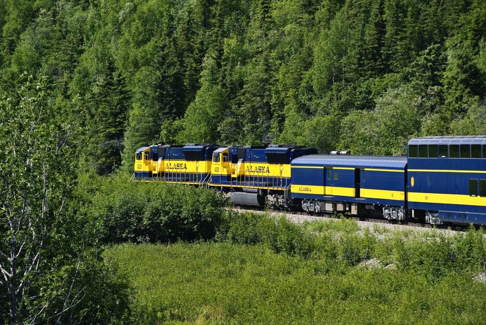 Tourist train winding it's way through the pristine Alaskan...