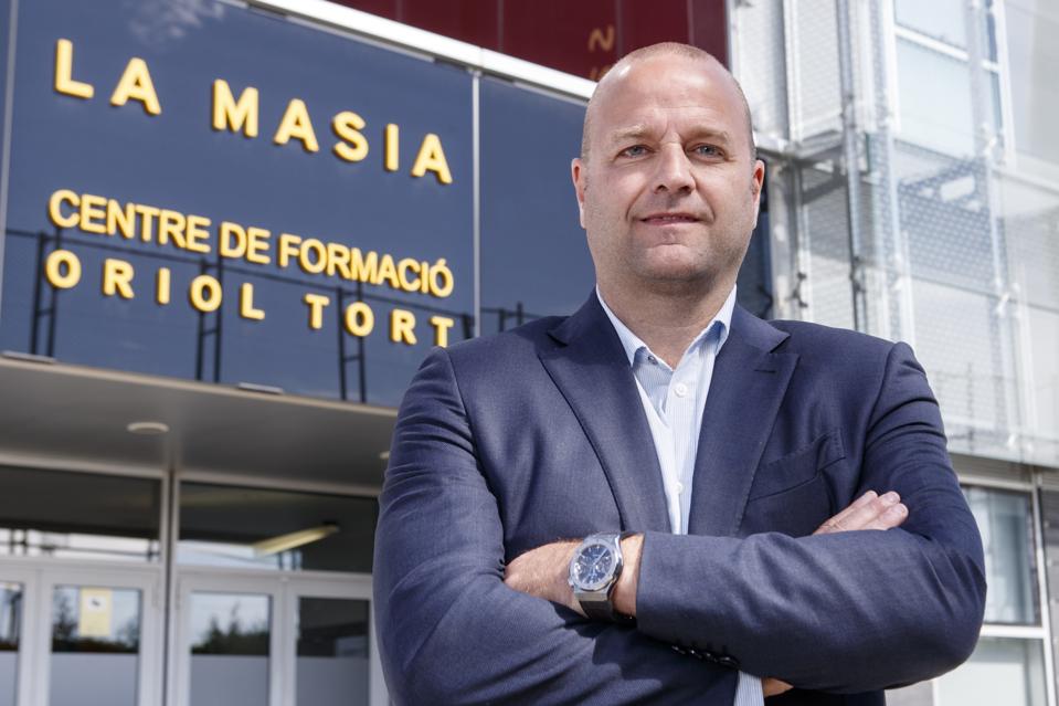 Ex-Barcelona director Xavier Vilajoana with arms folded in front of Barcelona's La Masia.