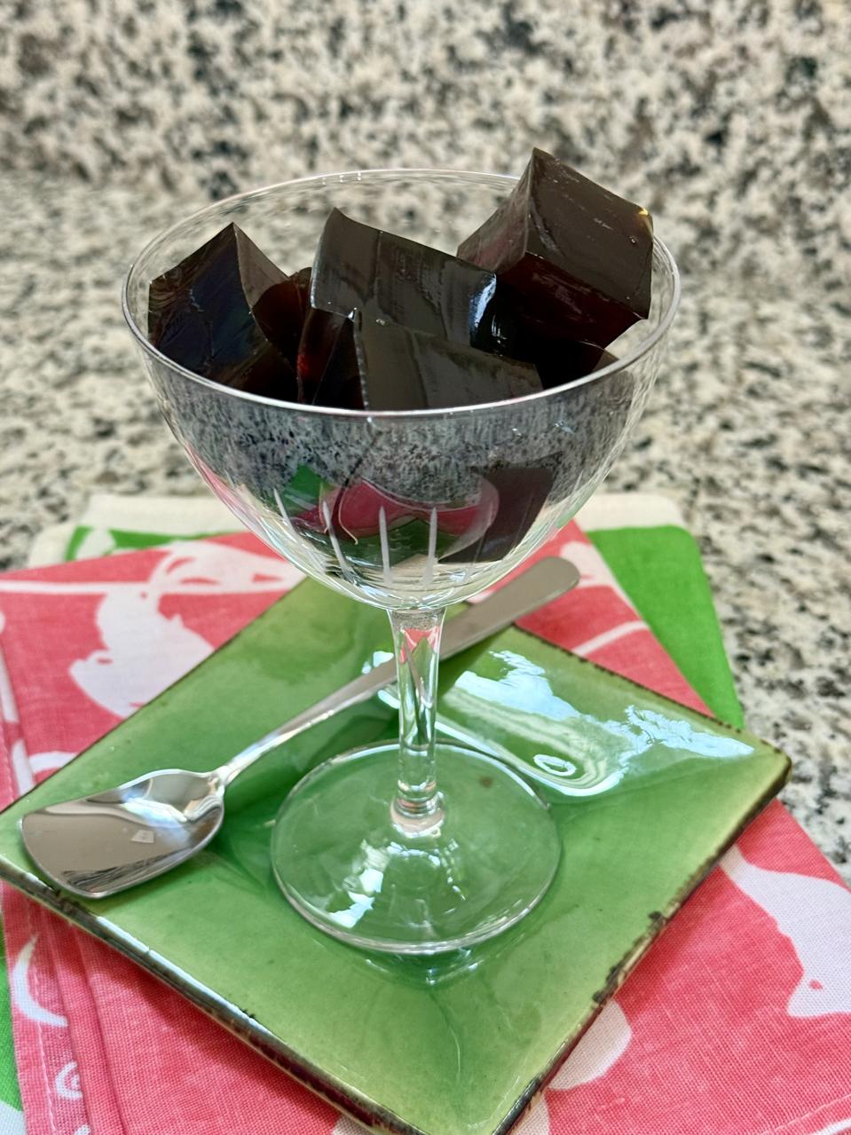 An espresso martini meets Japanese coffee jelly for a chic, addictive treat that is a snap to make at home.In this photograph by Elizabeth Karmel is an elegant Nick and Nora glass filled with square chunks of cold, glossy-brown jiggly, boozy coffee gelatin.