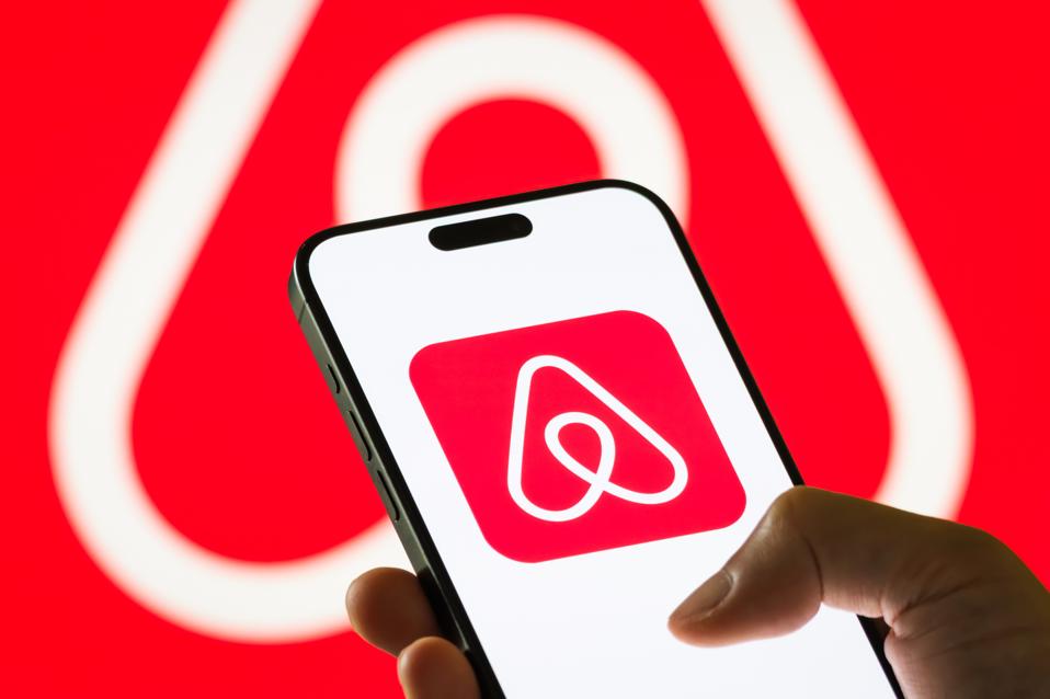 Airbnb Inc. logo displayed on smartphone screen