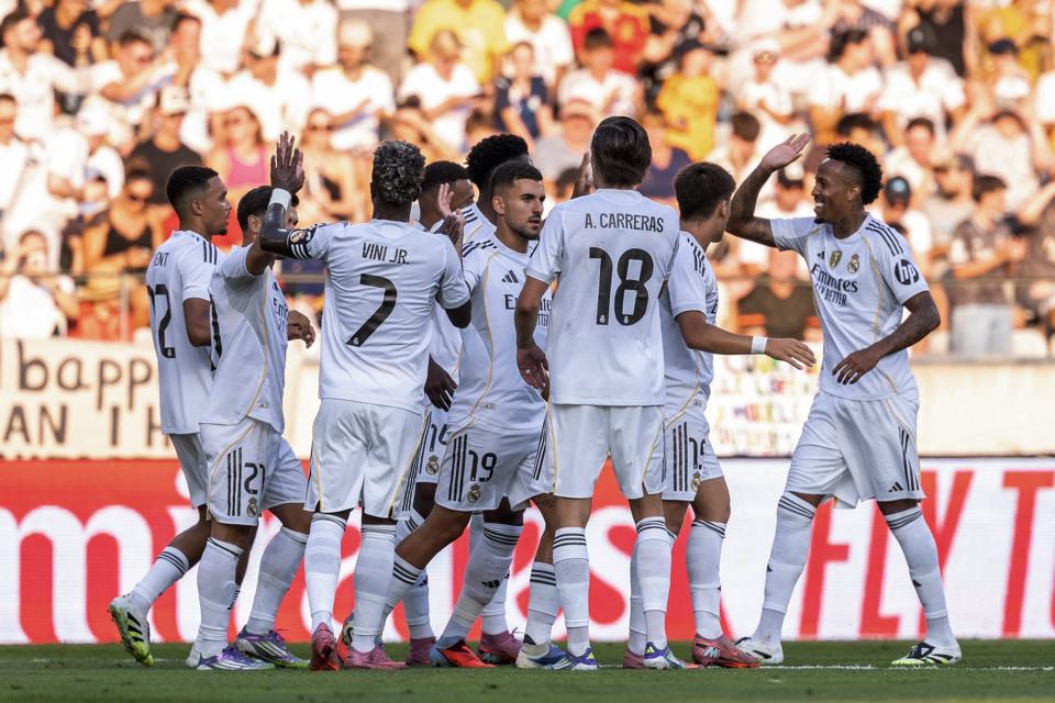 Real Madrid players celebrate a goal in preseason.