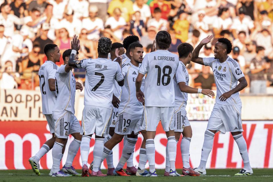 Real Madrid players celebrate a goal in preseason.