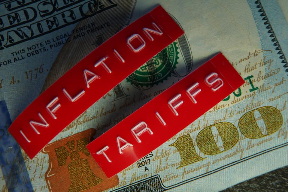Red Tariffs and Inflation labels on a hundred dollar bill
