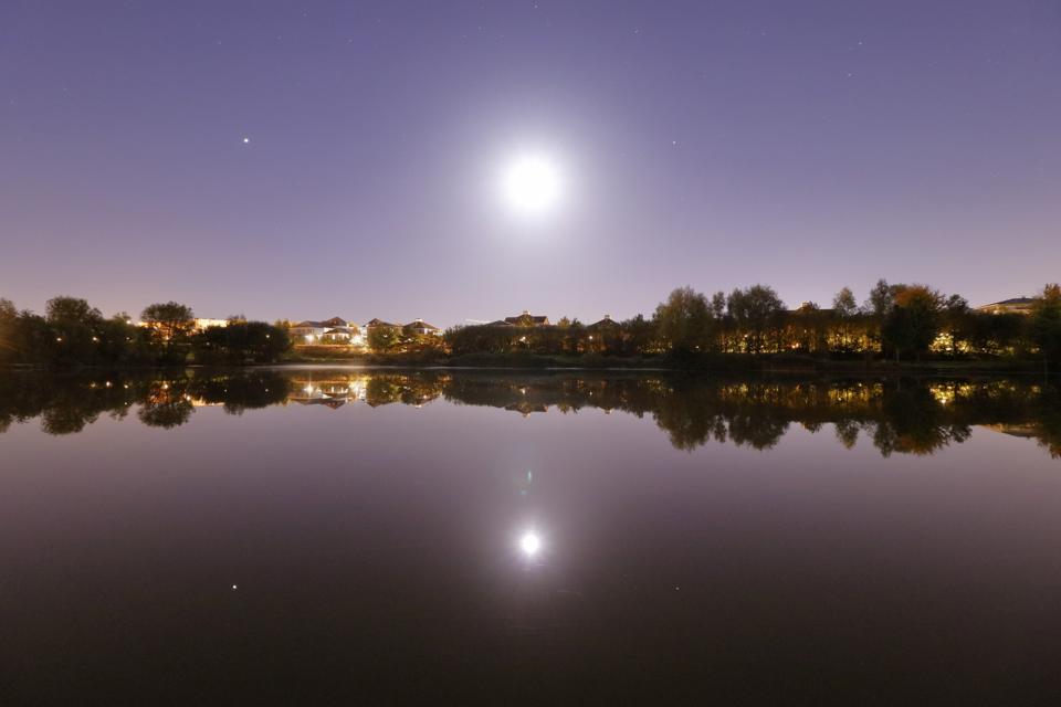 The Moon above the pond of Bussy Saint Georges, France