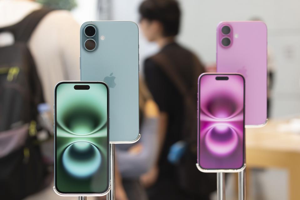 The new iPhone 16 and iPhone 16 Plus on display inside...