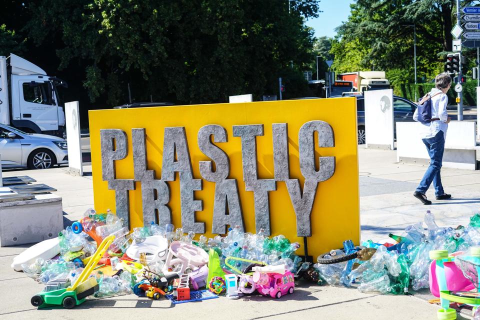 A man walks behind a public art installation by Canadian...