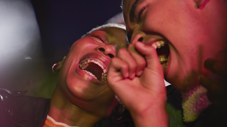 Cheerful couple enjoying movie