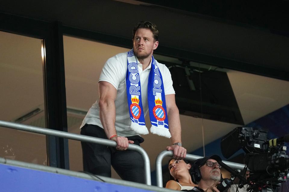Former NFL star JJ Watt looks on from the stands as Espanyol plays Atlético Madrid.