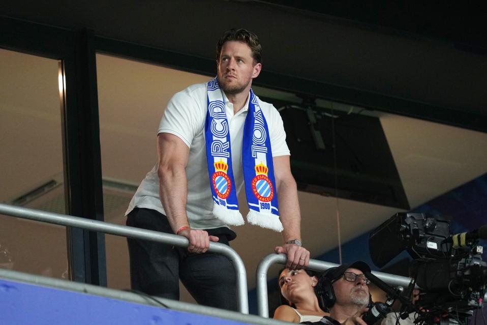 Former NFL star JJ Watt looks on from the stands as Espanyol plays Atlético Madrid.