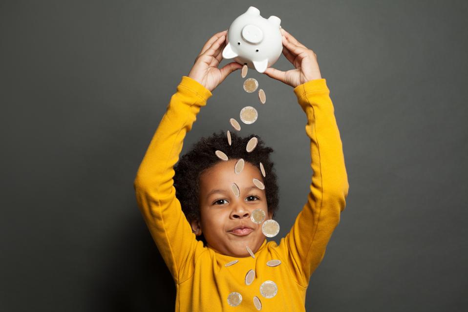 Happy black child and money rain on black background
