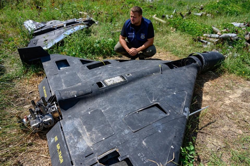 Ukrainian prosecutor examining a Shahed-136 drone