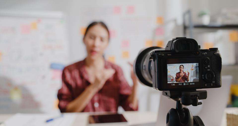 Close up of young woman teacher teaching online lesson class on video call via camera at home.