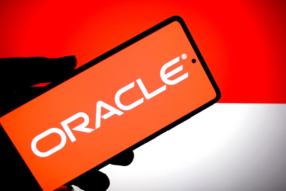 In this photo illustration, an Oracle logo is seen displayed...