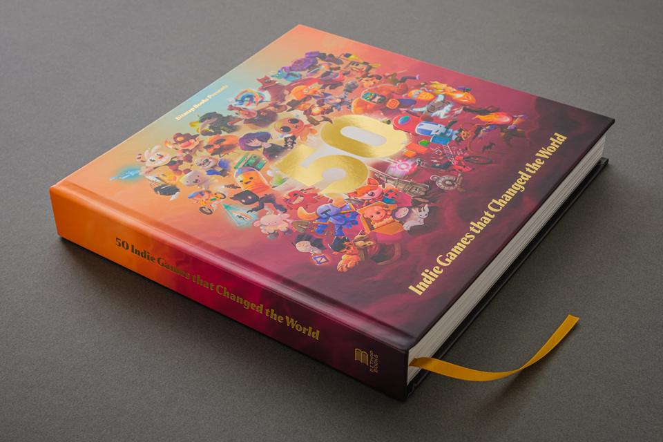A copy of '50 Indie Games that Changed the World' on a grey table