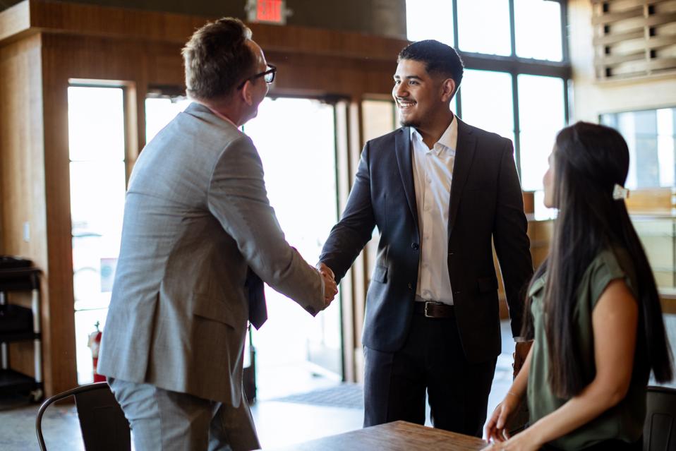 Diverse group of Business Professionals Meet to Discuss Plans for Success