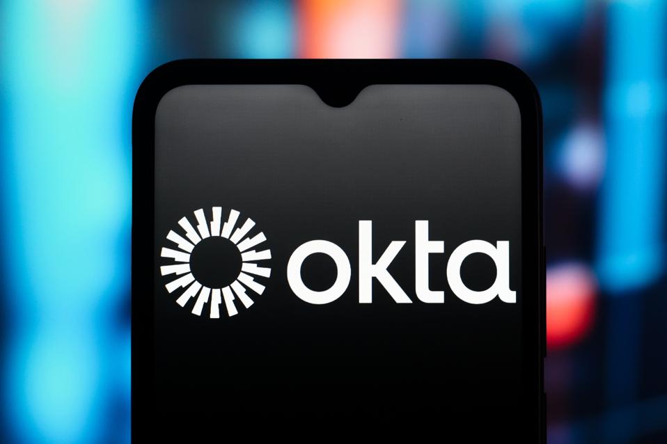 In this photo illustration, the Okta logo is seen displayed...