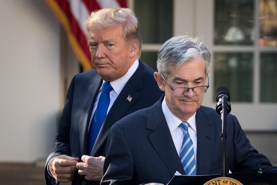 President Trump looks on in November of 2017 at his announcement of Jerome Pwowell to be the Chairman of the Federal Reserve. This year, he has been pressuring Powell to cut interest rates and threatened to fire him. (Photo by Drew Angerer/Getty Images)