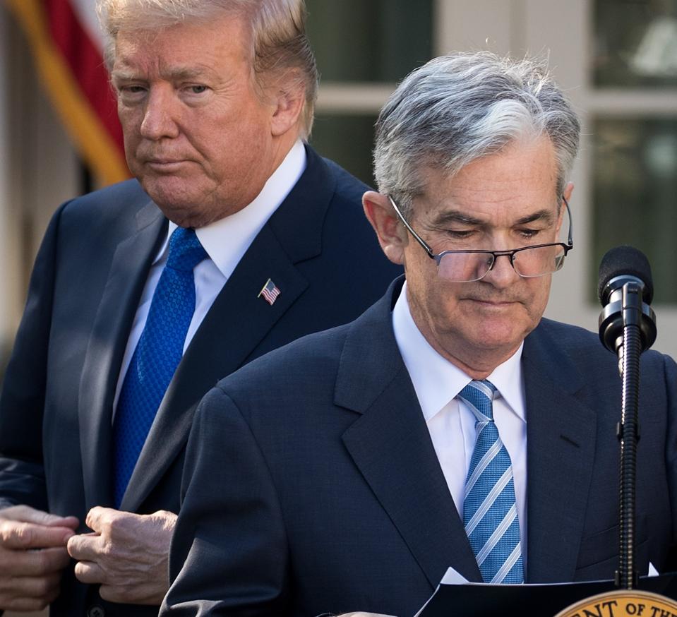 President Trump looks on in November of 2017 at his announcement of Jerome Pwowell to be the Chairman of the Federal Reserve. This year, he has been pressuring Powell to cut interest rates and threatened to fire him. (Photo by Drew Angerer/Getty Images)