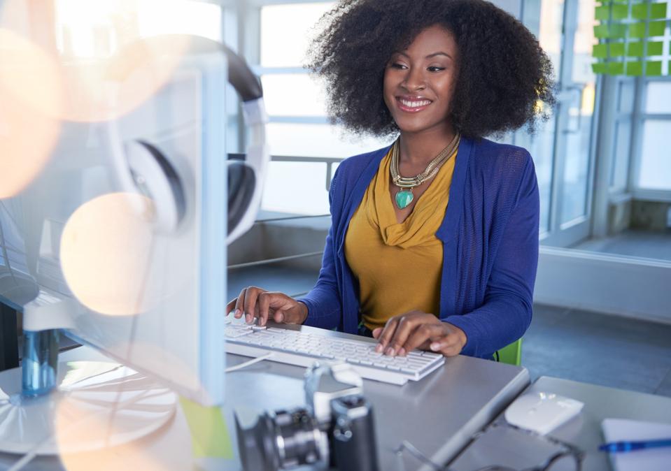 Black female entrepreneur working in a high end modern tech work space