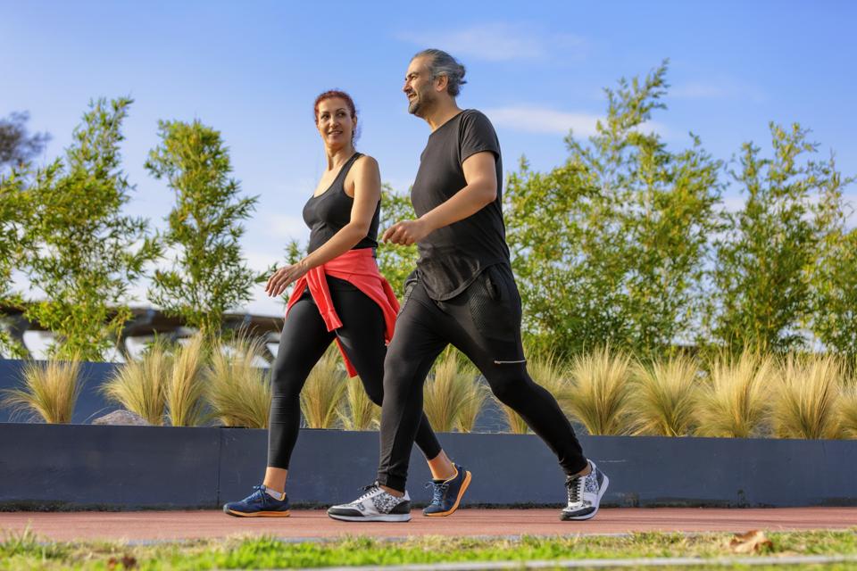 Mature Adult Couple Walking in a Park