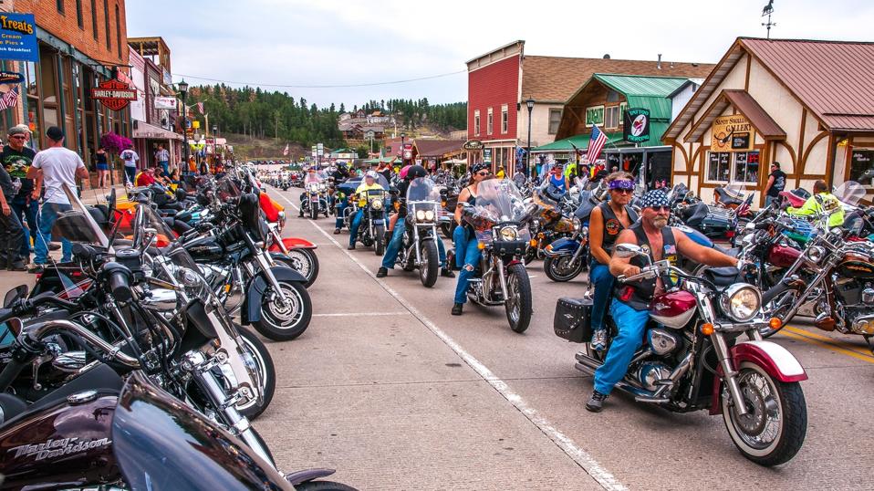 Motorcycle riders driving down the street in Keystone, South Dakota during the Sturgis Motorcycle rally on August 6, 2012