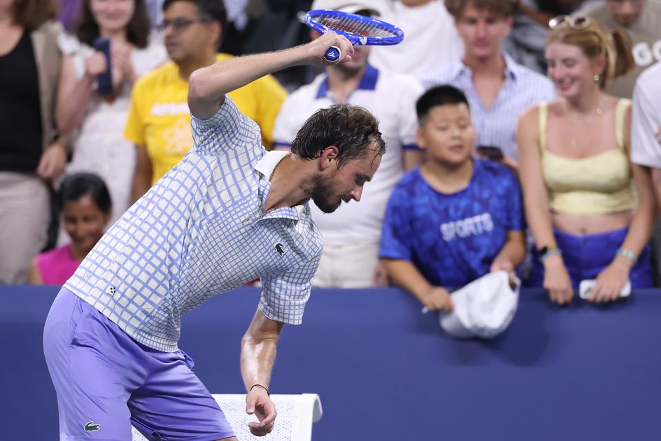 Daniil Medvedev breaks his racket after losing to Benjamin Bonzi in the U.S. Open.