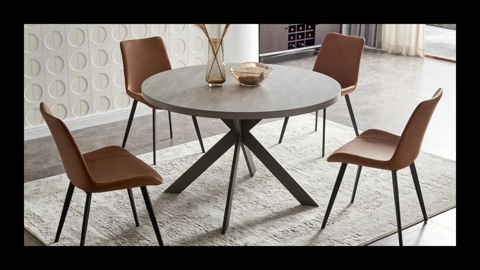 An image of the Latitude Run Round Dining Table Set on a black background.